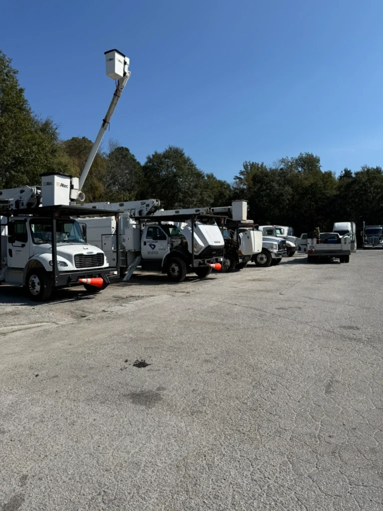 Fleet of trucks in a parking lot.